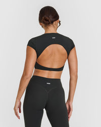 SoftMotion™ Short Sleeve Crop Top with White Logo | Soft Black