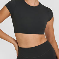 SoftMotion™ Short Sleeve Crop Top with White Logo | Soft Black