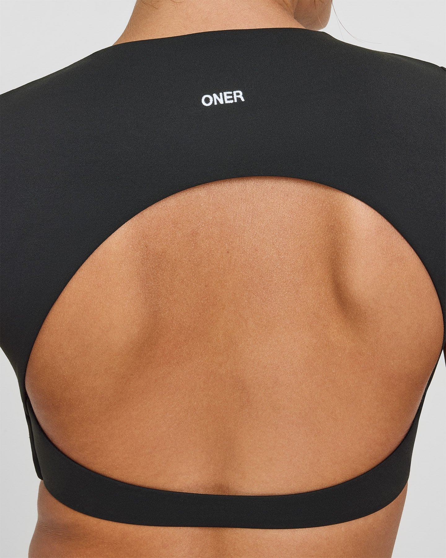 SoftMotion™ Short Sleeve Crop Top with White Logo | Soft Black