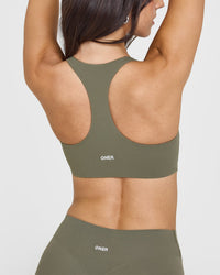 SoftMotion™ Sports Bra with White Logo | Alpine Green