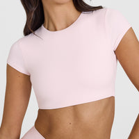 SoftMotion™ Short Sleeve Crop Top with White Logo | Ballet Pink