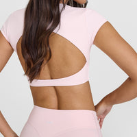 SoftMotion™ Short Sleeve Crop Top with White Logo | Ballet Pink