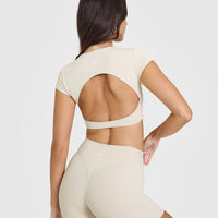 SoftMotion™ Short Sleeve Crop Top with White Logo | Sand
