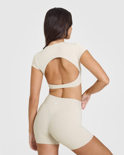 SoftMotion™ Short Sleeve Crop Top with White Logo | Sand