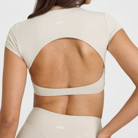 SoftMotion™ Short Sleeve Crop Top with White Logo | Sand
