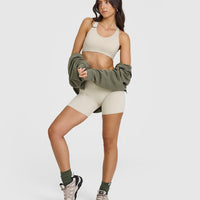SoftMotion™ Sports Bra with White Logo | Sand
