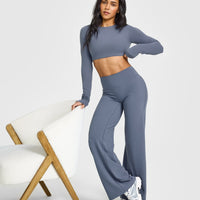 SoftMotion™ Long Sleeve Crop Top with White Logo | Granite Blue
