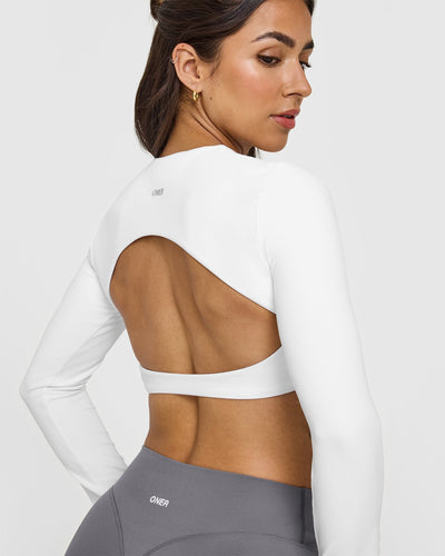 SoftMotion™ Long Sleeve Crop Top with White Logo | White