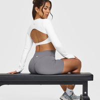SoftMotion™ Long Sleeve Crop Top with White Logo | White