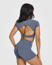 SoftMotion™ Short Sleeve Crop Top with White Logo | Granite Blue