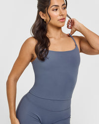 SoftMotion™ Strappy Mid Vest with Built in Bra Shelf with White Logo | Granite Blue
