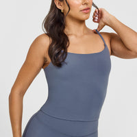 SoftMotion™ Strappy Mid Vest with Built in Bra Shelf with White Logo | Granite Blue