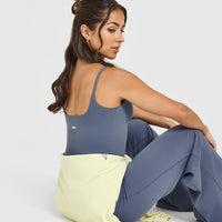 SoftMotion™ Strappy Mid Vest with Built in Bra Shelf with White Logo | Granite Blue