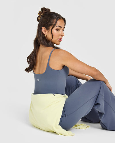 SoftMotion™ Strappy Mid Vest with Built in Bra Shelf with White Logo | Granite Blue