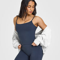 SoftMotion™ Strappy Mid Vest with Built in Bra Shelf with White Logo | True Blue