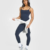 SoftMotion™ Strappy Mid Vest with Built in Bra Shelf with White Logo | True Blue