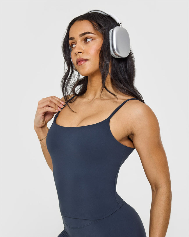 SoftMotion™ Strappy Mid Vest with Built in Bra Shelf with White Logo | True Blue