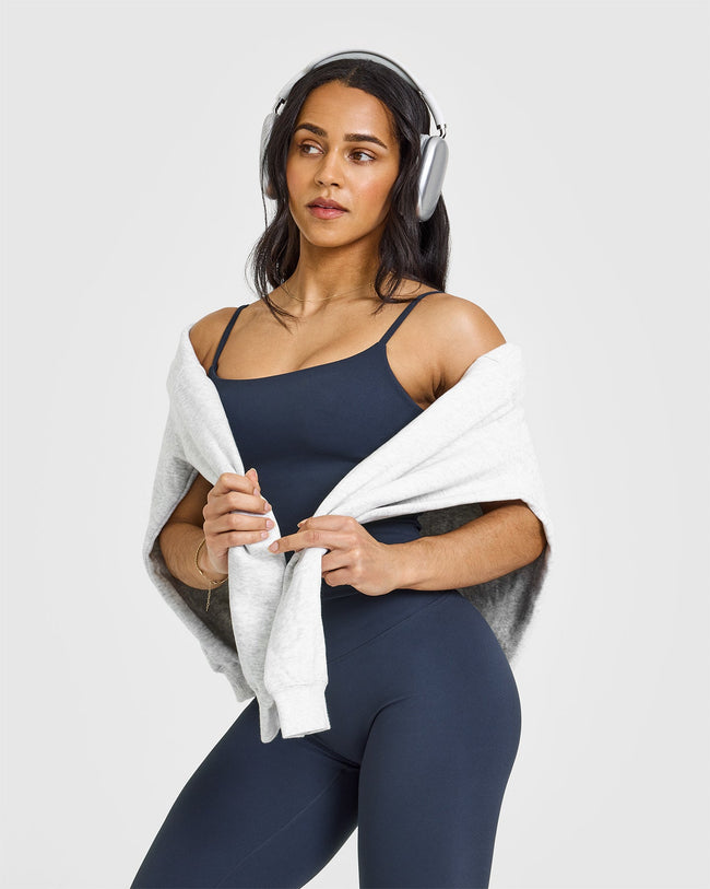 SoftMotion™ Strappy Mid Vest with Built in Bra Shelf with White Logo | True Blue