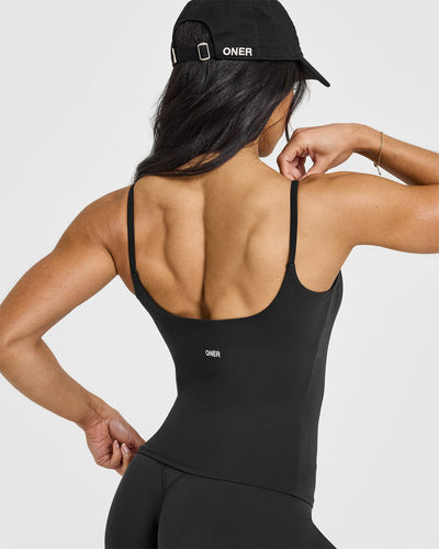 SoftMotion™ Strappy Vest with Built in Bra Shelf with White Logo | Soft Black