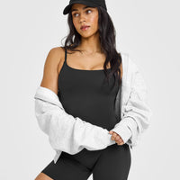 SoftMotion™ Strappy Vest with Built in Bra Shelf with White Logo | Soft Black