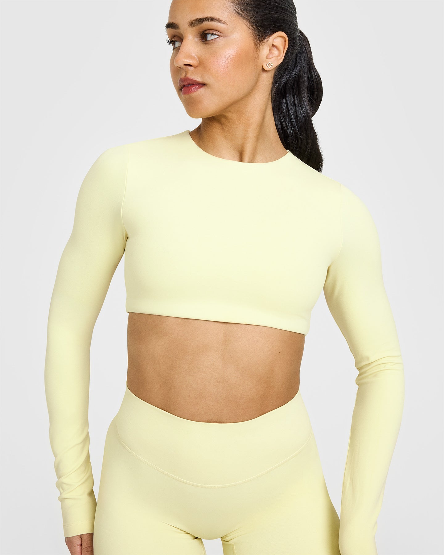 SoftMotion™ Long Sleeve Crop Top with White Logo | Pastel Yellow