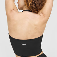 SoftMotion™ Halter Neck Mid Vest with Built in Bra Shelf with White Logo | Soft Black