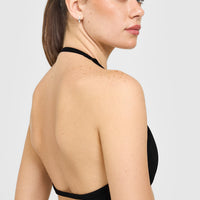 EnhanceLift™ Seamless Minimal Halter Neck Bralette with White Logo | Black