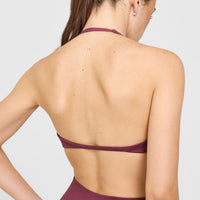 EnhanceLift™ Seamless Minimal Halter Neck Bralette with White Logo | Burnt Maroon