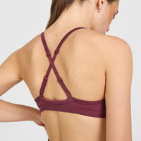 EnhanceLift™ Seamless Strappy Sports Bra with White Logo | Burnt Maroon