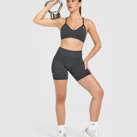 EnhanceLift™ Seamless Strappy Sports Bra with White Logo | Coal