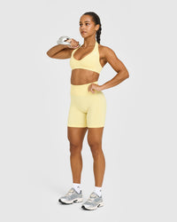 Effortless Seamless Halter Neck Sports Bra with White Logo | Sherbert Yellow