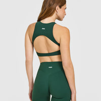 SoftMotion™ High Neck Sports Bra with White Logo | Dark Racing Green