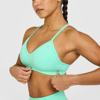 EnhanceLift™ Seamless Strappy Sports Bra with White Logo | Peppermint Green
