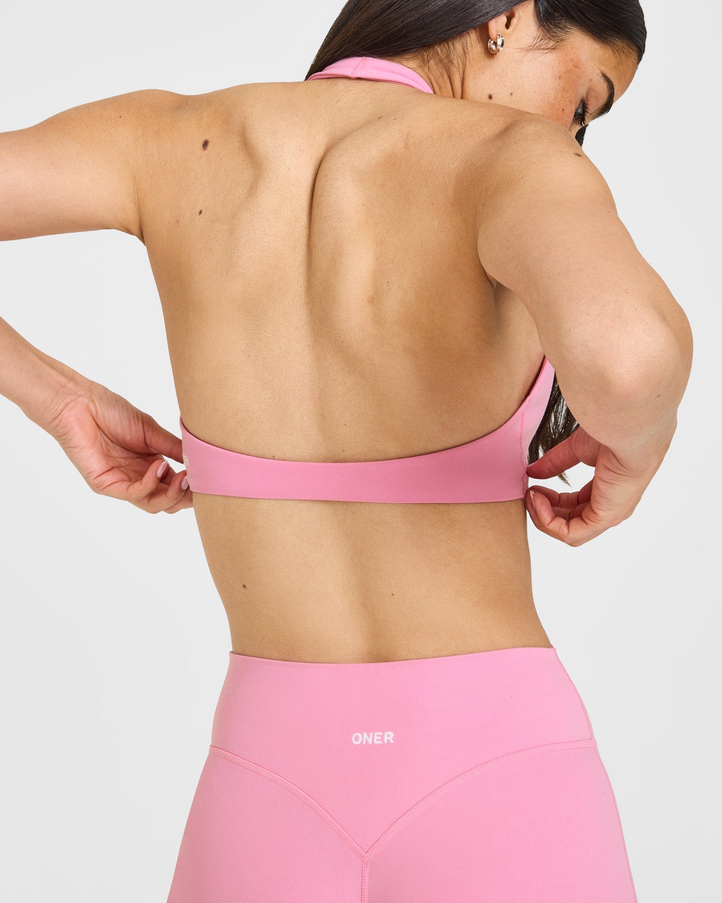 SoftMotion™ Minimal Halter Neck Bralette with White Logo | Rose Pink