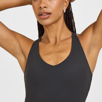 SoftMotion™ Racer Back Mid Vest with Built in Bra Shelf with White Logo | Coal