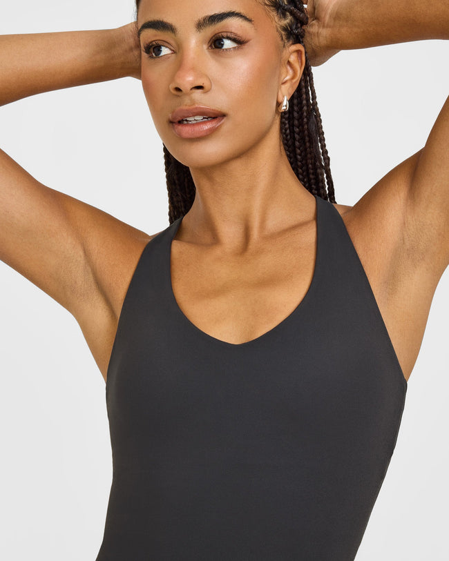 SoftMotion™ Racer Back Mid Vest with Built in Bra Shelf with White Logo | Coal
