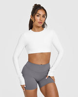 SoftMotion™ Long Sleeve Crop Top with White Logo | White