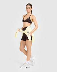 EnhanceLift™ Seamless Minimal Halter Neck Bralette with White Logo | Plum Brown