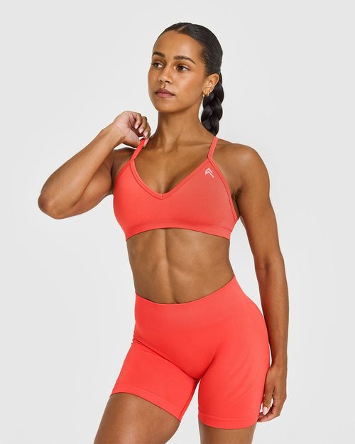 Oner Modal EnhanceLift™ Seamless Strappy Sports Bra with White Logo | Charged Coral