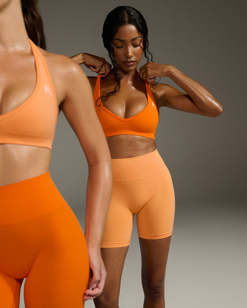Effortless Seamless Halter Neck Sports Bra with White Logo | Flame Orange