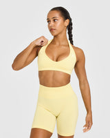 Effortless Seamless Halter Neck Sports Bra with White Logo | Sherbert Yellow