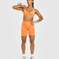 EffortlessLift™ Seamless Shorts with White Logo | Apricot Orange