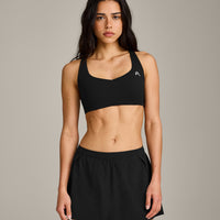 EasyLift™ Cross Back Sports Bra with Gray Logo | Black