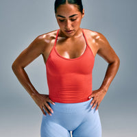 EnhanceLift™ Seamless Strappy Racer Tank Top with Built in Bra Shelf with Gray Logo | Dark Charged Coral