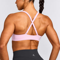 EasyLift™ Cross Back Sports Bra with Gray Logo | Chalk Pink