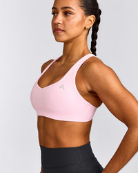 EasyLift™ Cross Back Sports Bra with Gray Logo | Chalk Pink