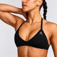EnhanceLift™ Seamless Minimal Halter Neck Bralette with Gray Logo | Black