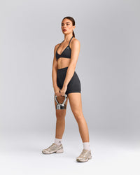 EnhanceLift™ Seamless Minimal Halter Neck Bralette with Gray Logo | Coal