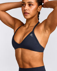 EnhanceLift™ Seamless Minimal Halter Neck Bralette with Gray Logo | True Blue