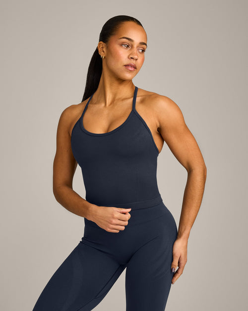 EnhanceLift™ Seamless Strappy Racer Tank Top with Built in Bra Shelf with Gray Logo | True Blue